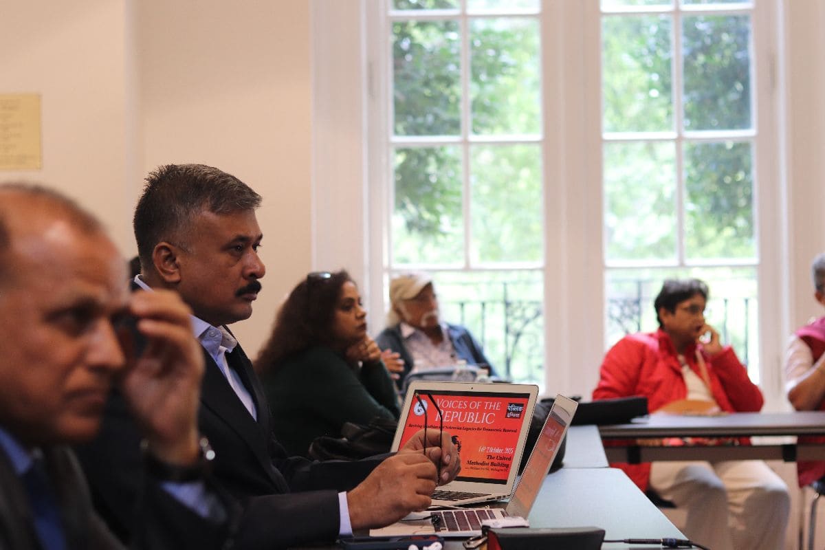 Attendees listening during session