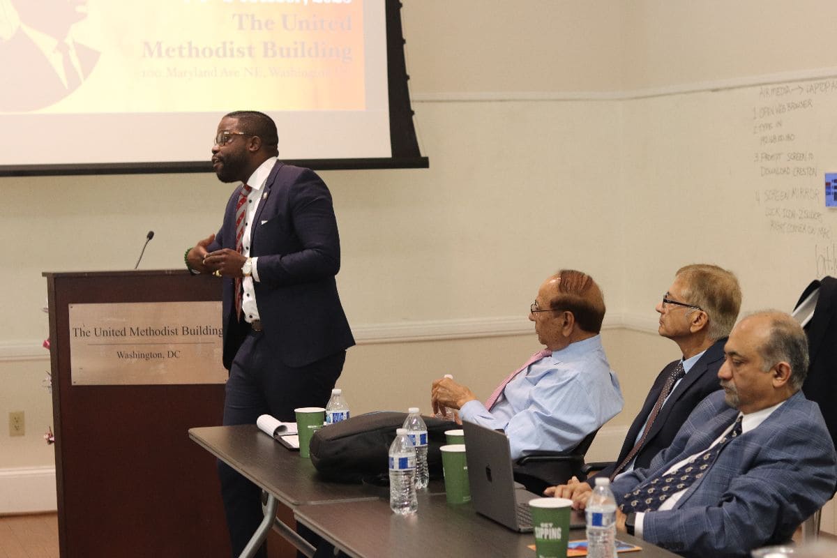 Speaker addressing the forum